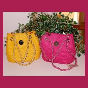 pink handbag and yellow handbag